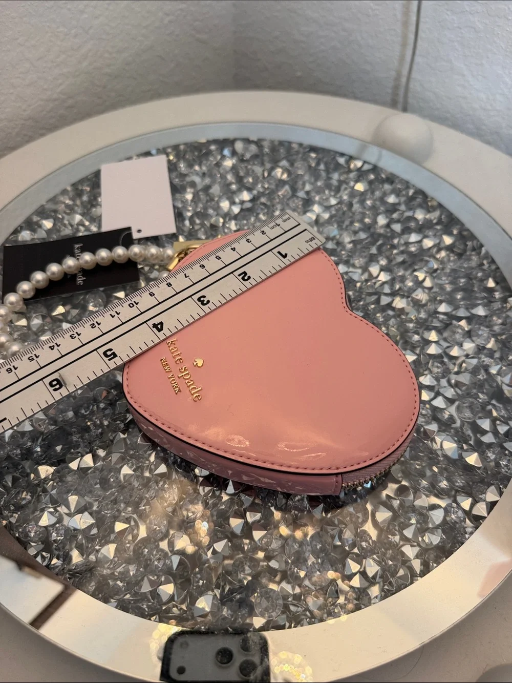 kate spade pink heart-shaped pearl wristlet clutch
